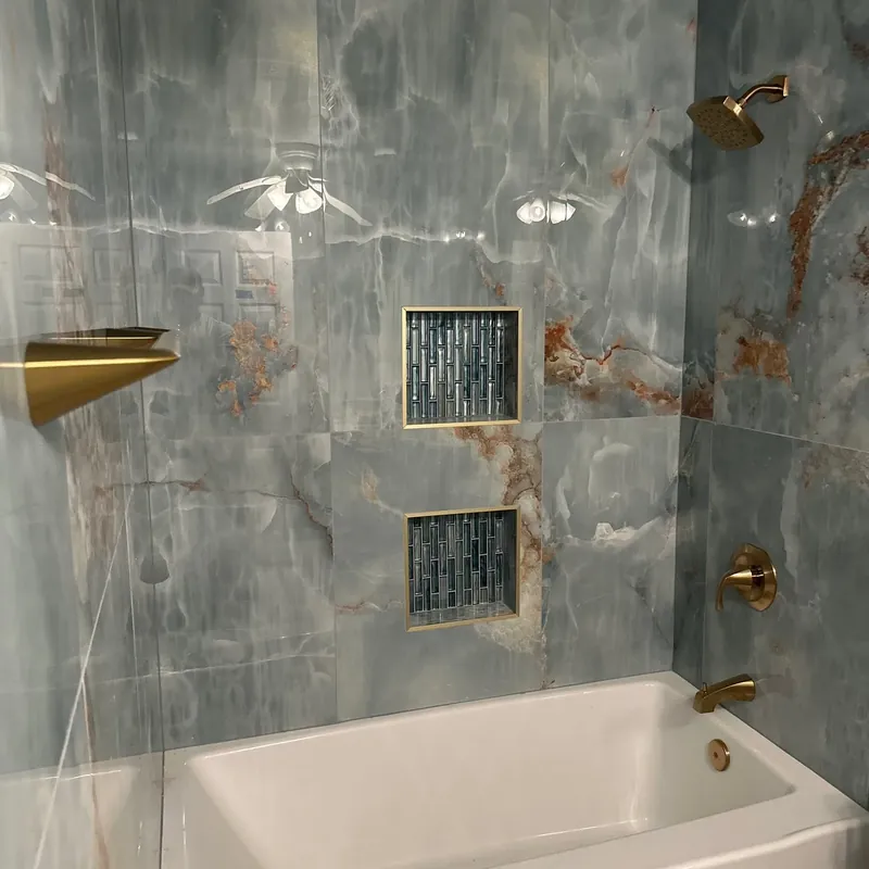 Onyx tile shower walls over new white bathtub, C&A Roofing & Construction