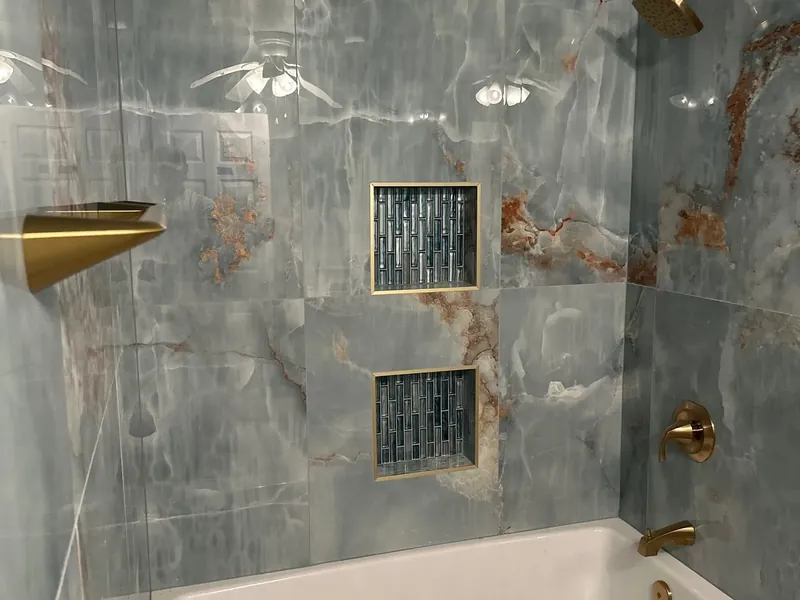 Onyx tile shower walls over new white bathtub, C&A Roofing & Construction