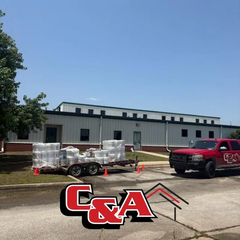 C&A truck and trailer with supplies at commercial building, C&A Roofing & Construction