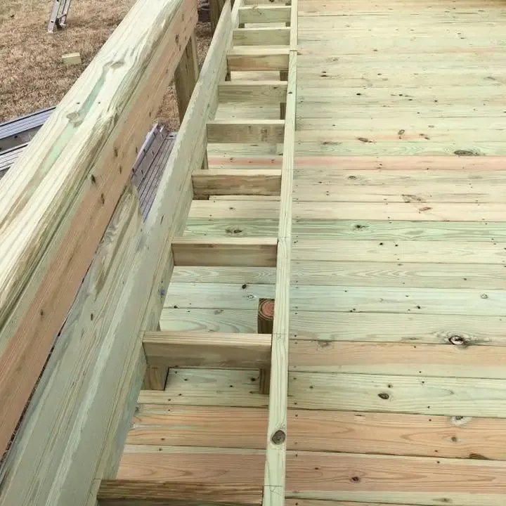 Long new deck with built-in bench and edge steps, C&A Roofing & Construction