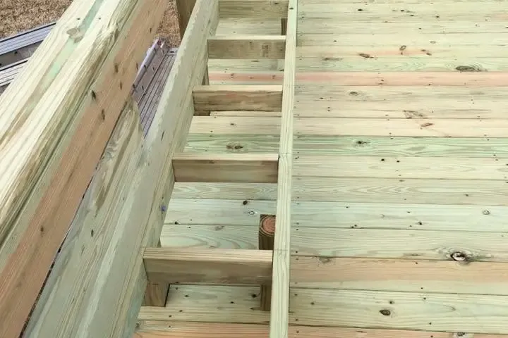 Long new deck with built-in bench and edge steps, C&A Roofing & Construction