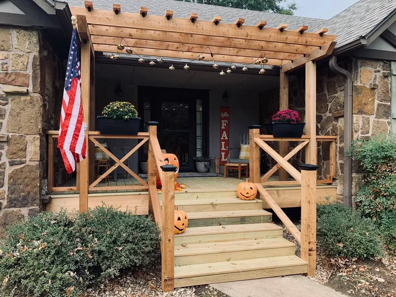 Front porch with new wooden pergola, railings, and steps, C&A Roofing & Construction