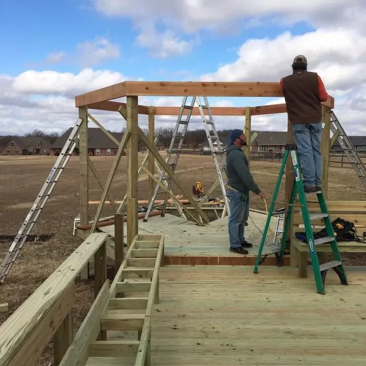 Crew framing wooden pavilion roof on new deck, C&A Roofing & Construction