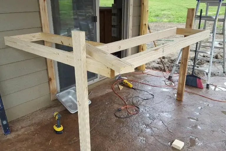 Framing for outdoor bar counter on patio, C&A Roofing & Construction