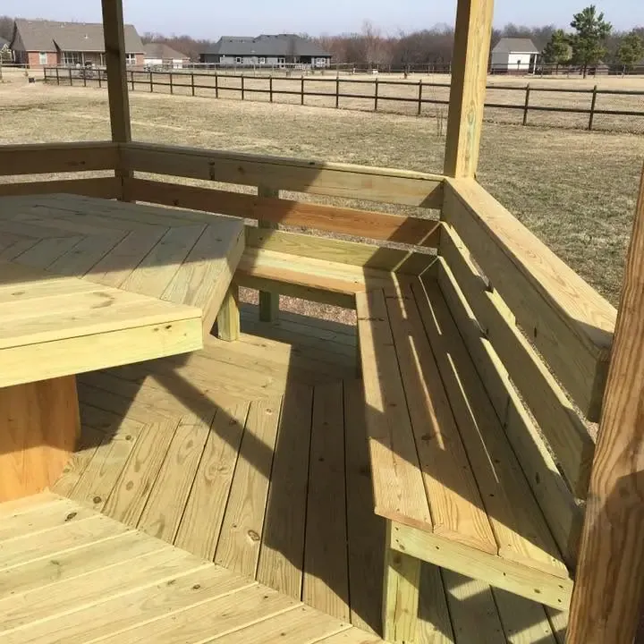Octagonal gazebo deck with built-in benches and table, C&A Roofing & Construction