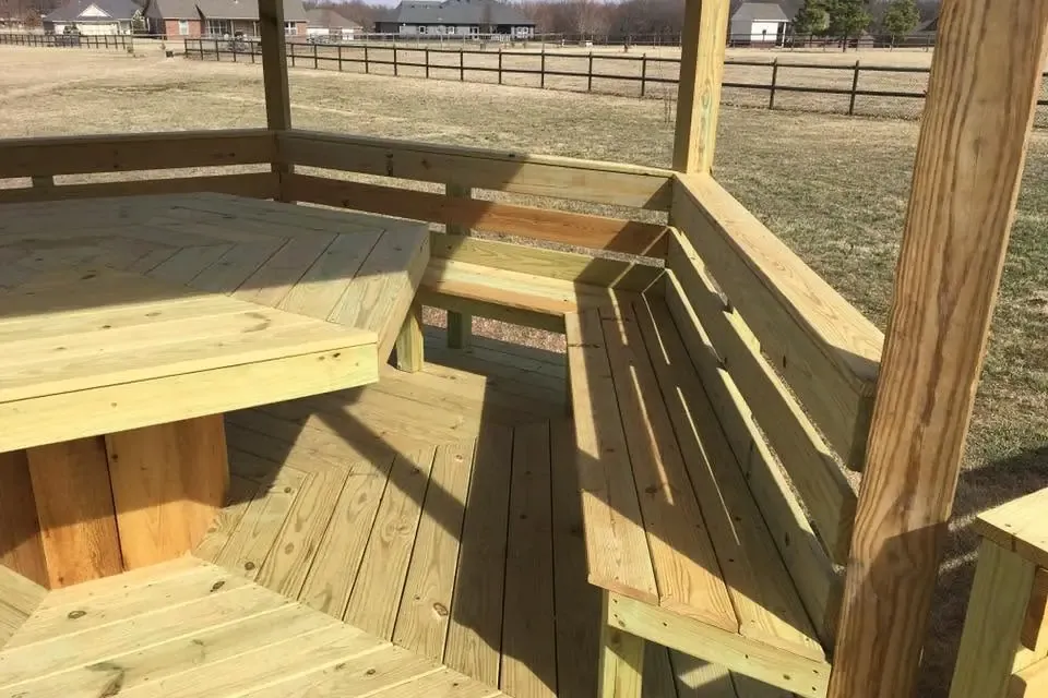 Octagonal gazebo deck with built-in benches and table, C&A Roofing & Construction