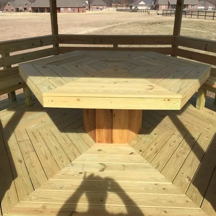 Octagonal gazebo with center table and benches, C&A Roofing & Construction