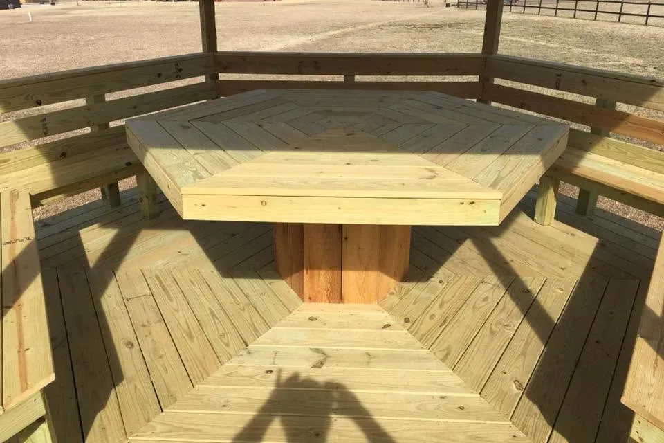 Octagonal gazebo with center table and benches, C&A Roofing & Construction