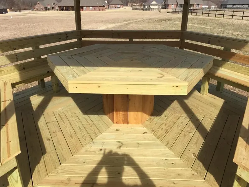 Octagonal gazebo with center table and benches, C&A Roofing & Construction