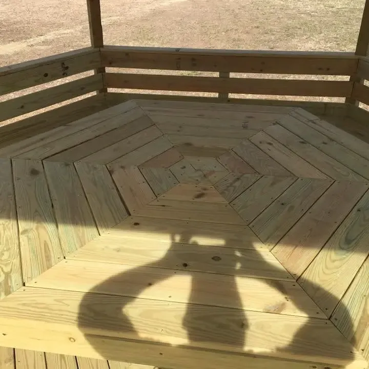 Octagonal starburst wood deck floor with railing, C&A Roofing & Construction