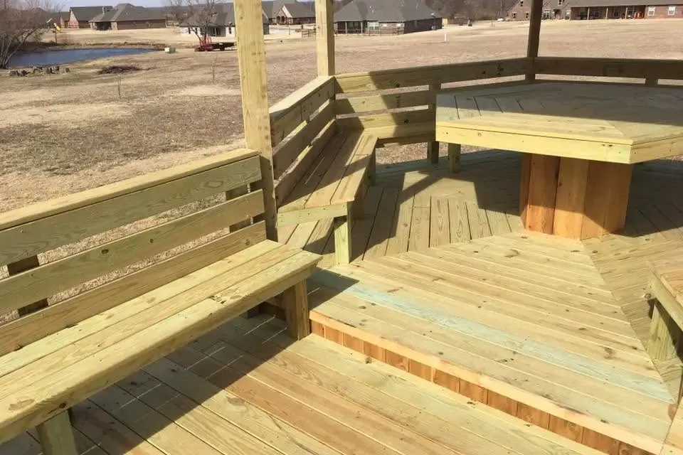 Octagonal wooden deck with built-in benches, C&A Roofing & Construction