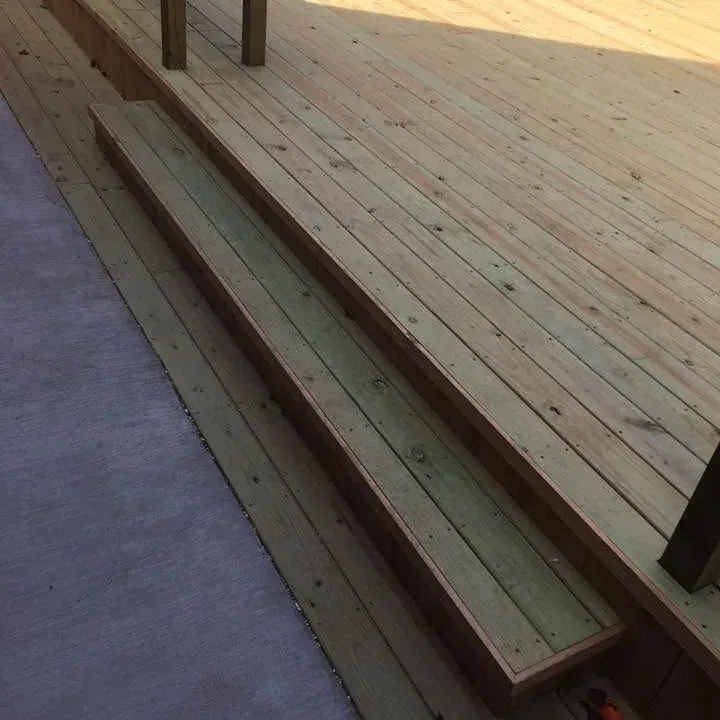 New deck with steps along edge, angled view, C&A Roofing & Construction