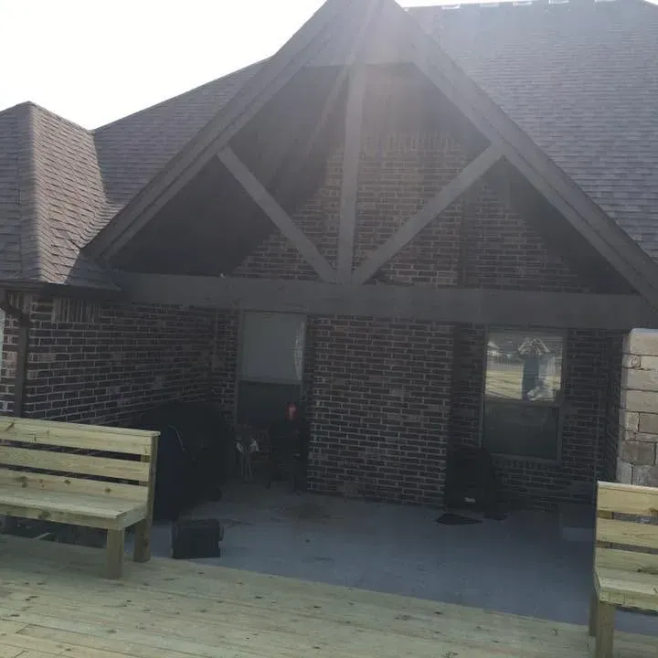 Covered patio opening to new deck with benches, C&A Roofing & Construction