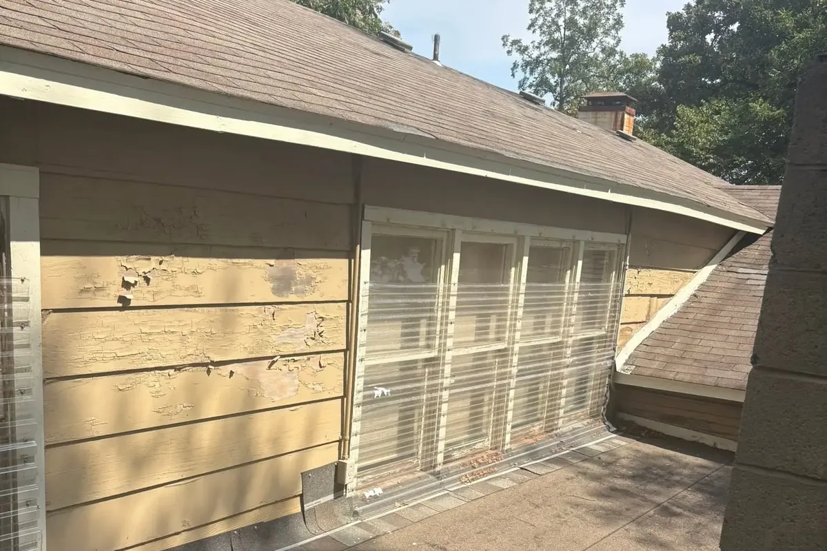 House siding with peeling, weathered paint, C&A Roofing & Construction
