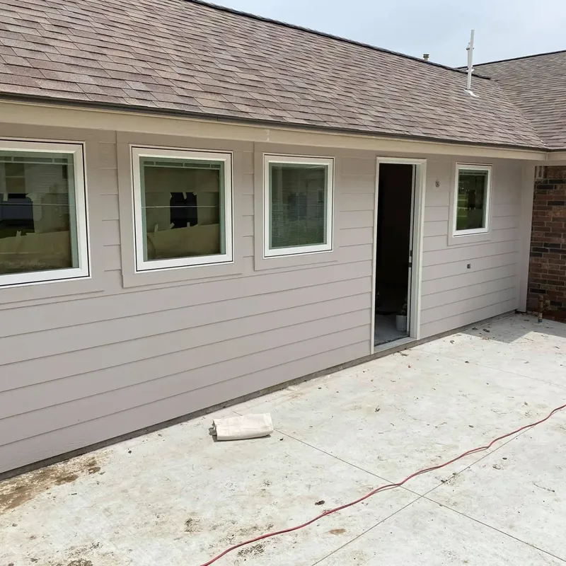 House exterior with new siding and windows, C&A Roofing & Construction