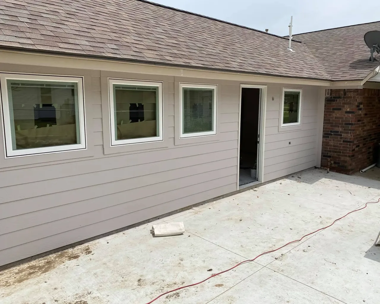 House exterior with new siding and windows, C&A Roofing & Construction