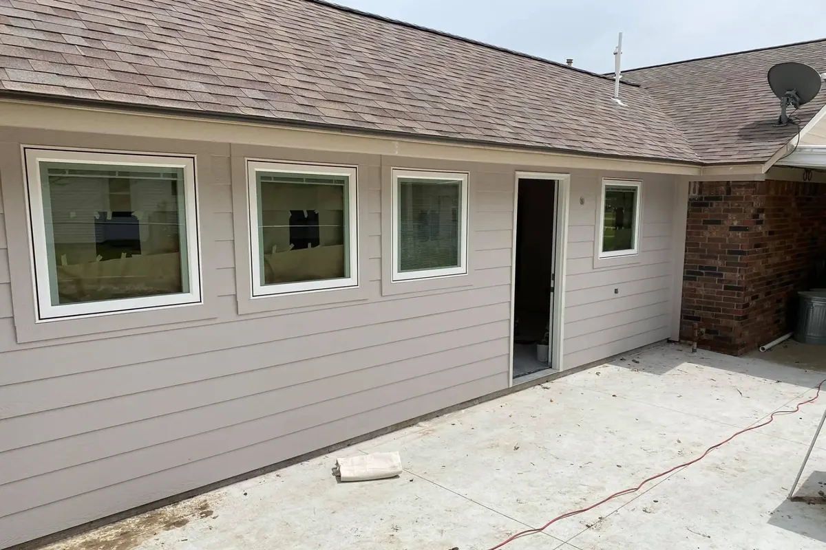 House exterior with new siding and windows, C&A Roofing & Construction