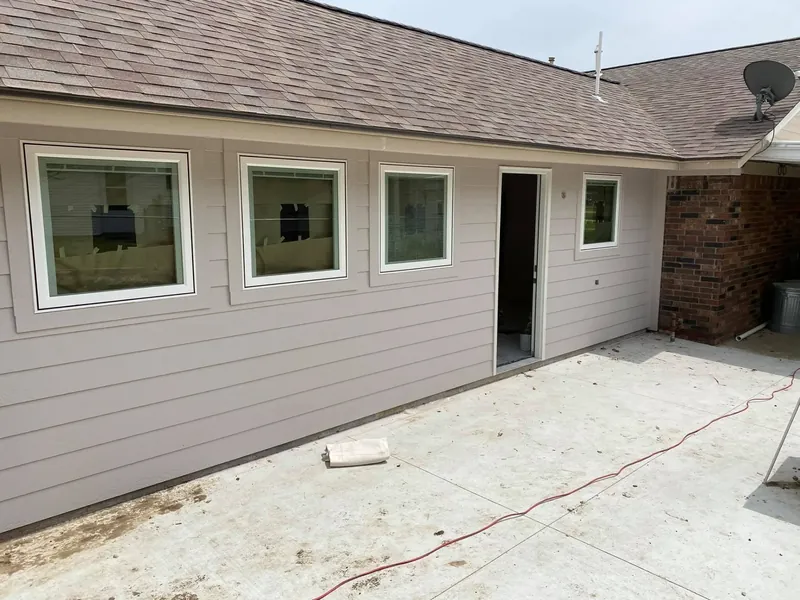 House exterior with new siding and windows, C&A Roofing & Construction