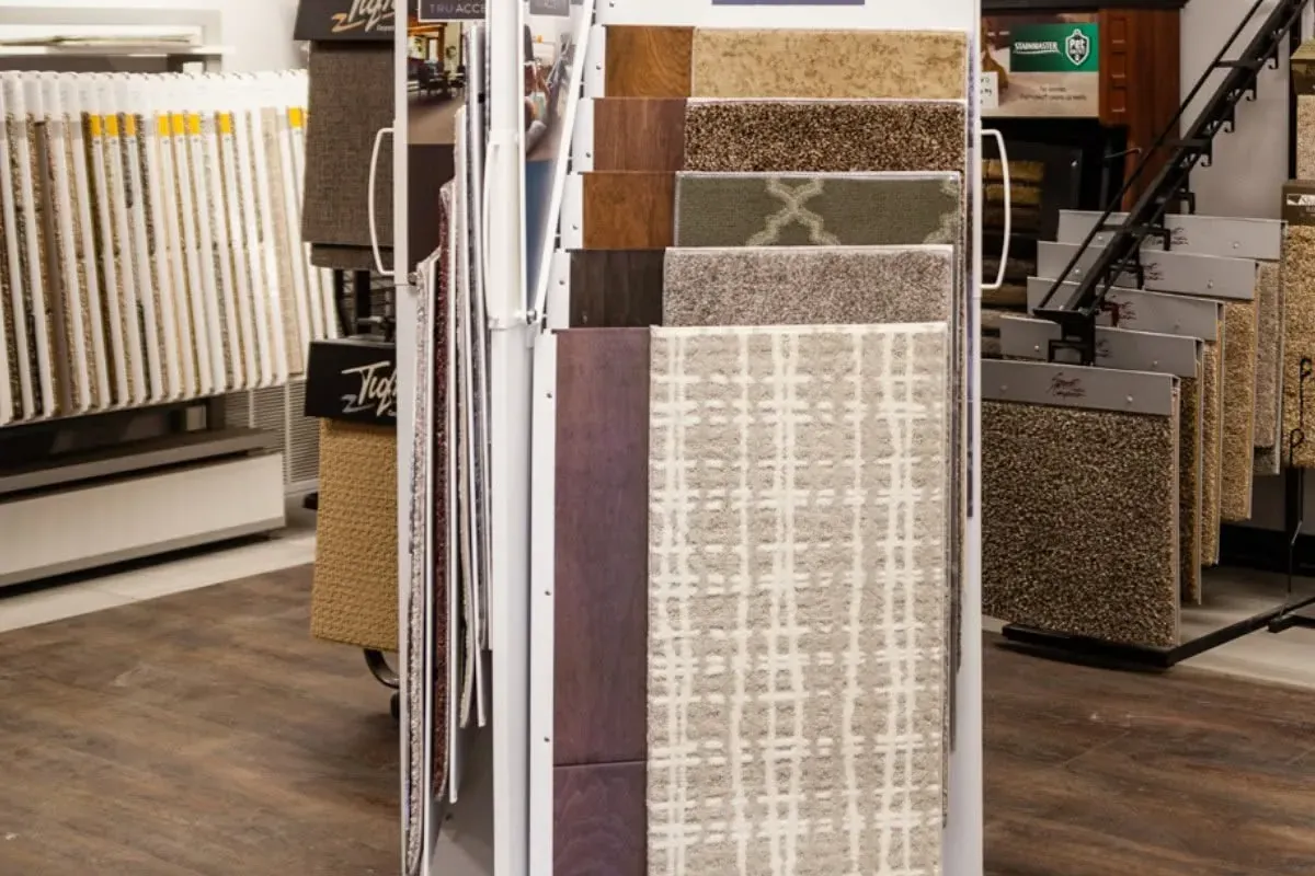 Shaw carpet and flooring sample display in showroom, C&A Roofing & Construction