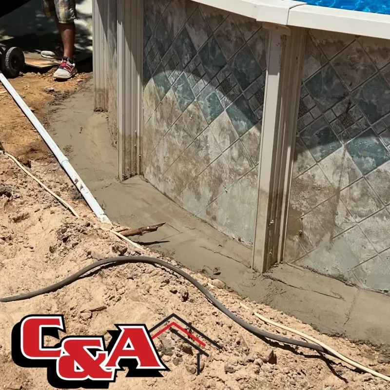 Above-ground pool wall base with fresh sand/sealing, C&A Roofing & Construction
