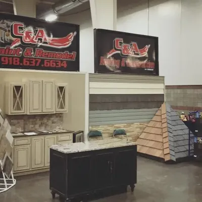 Trade show booth with cabinet, siding and roof samples, C&A Roofing & Construction