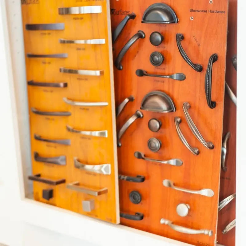 Wood board display of cabinet pulls and handles, C&A Roofing & Construction