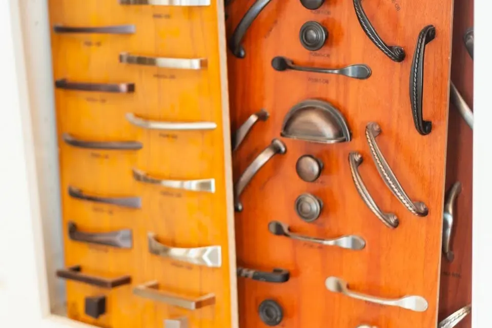 Wood board display of cabinet pulls and handles, C&A Roofing & Construction