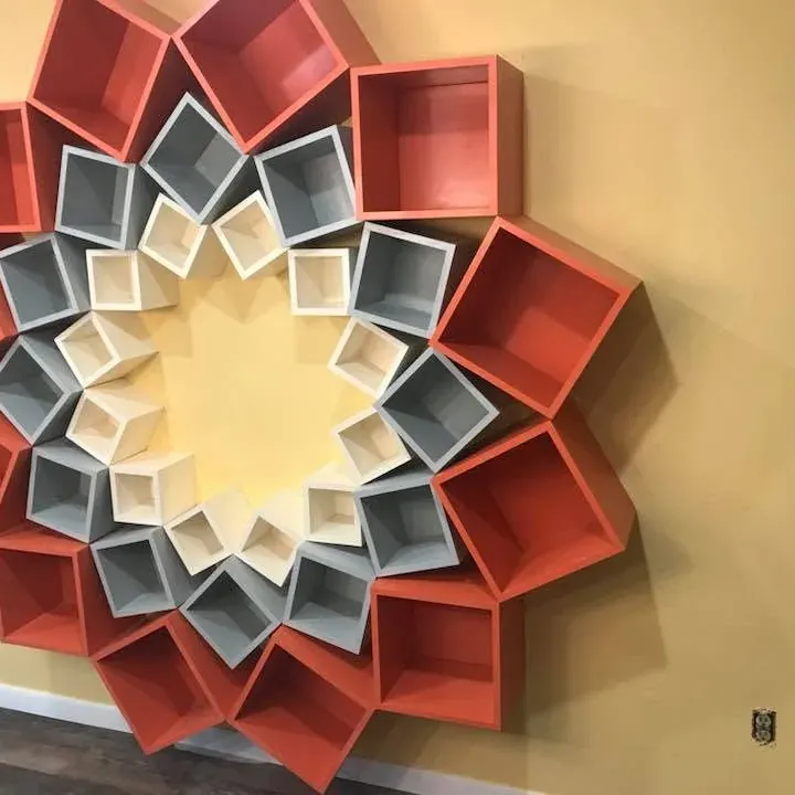 Red and white geometric flower-shaped wall shelf, C&A Roofing & Construction