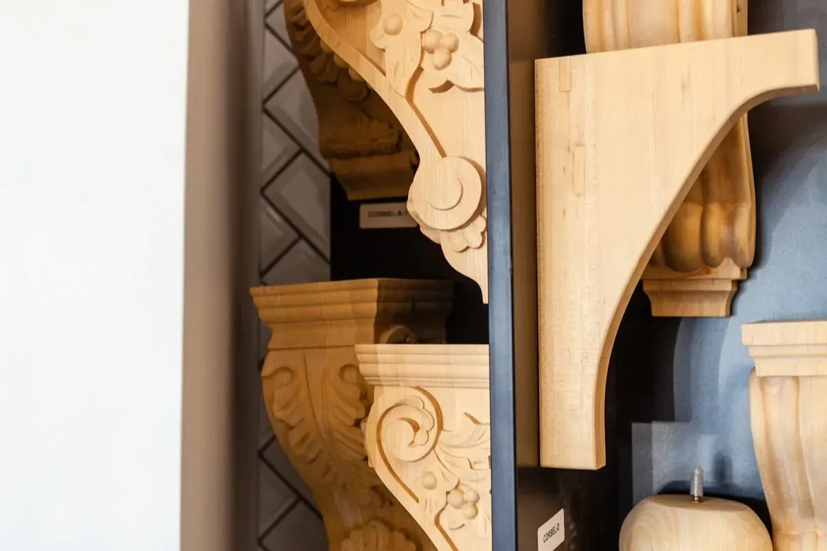 Showroom display of carved wooden corbels, C&A Roofing & Construction
