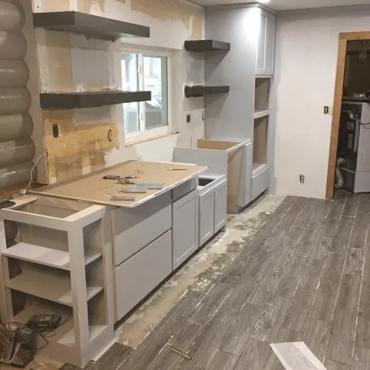 Gray cabinets and floating shelves going in, new tile floor, C&A Roofing & Construction