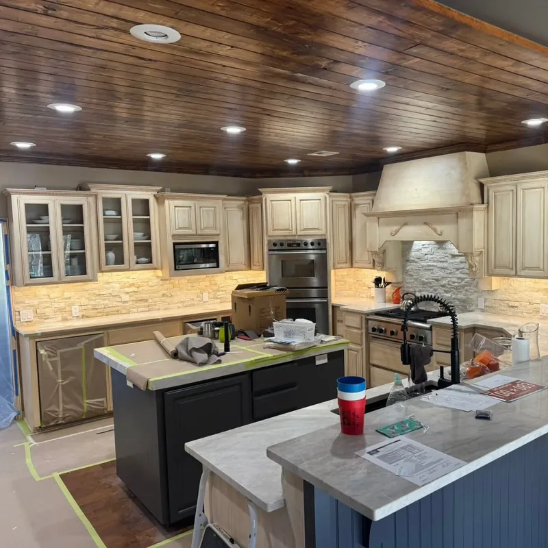 Kitchen with new cabinets, island and wood plank ceiling, C&A Roofing & Construction