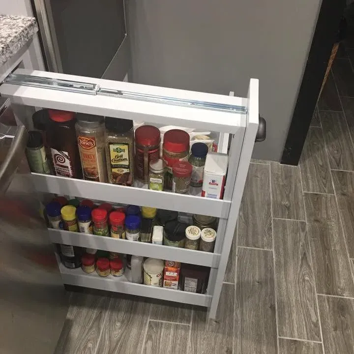 Pull-out spice rack cabinet over wood-look tile floor, C&A Roofing & Construction