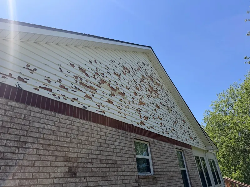 Brick house gable siding with heavy peeling paint, C&A Roofing & Construction