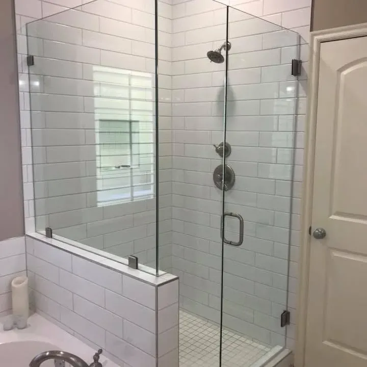Finished white subway tile shower with glass enclosure and tub, C&A Roofing & Construction
