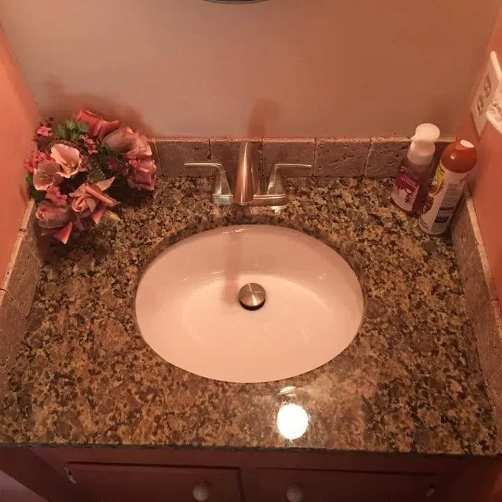 Granite vanity top with undermount sink and faucet, C&A Roofing & Construction
