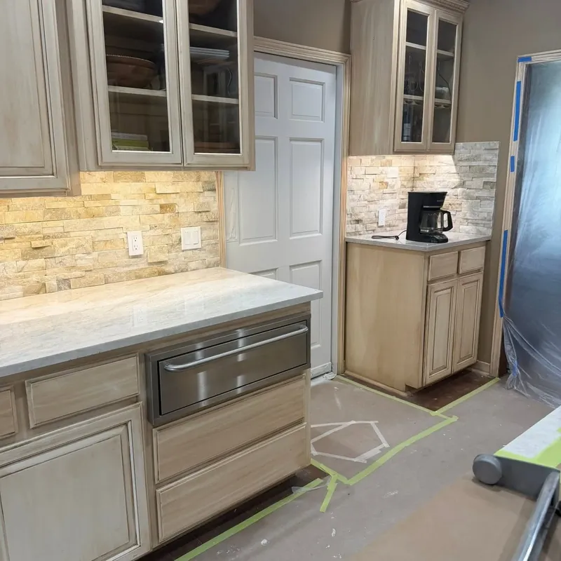 Painted gray kitchen cabinets with stone backsplash, C&A Roofing & Construction