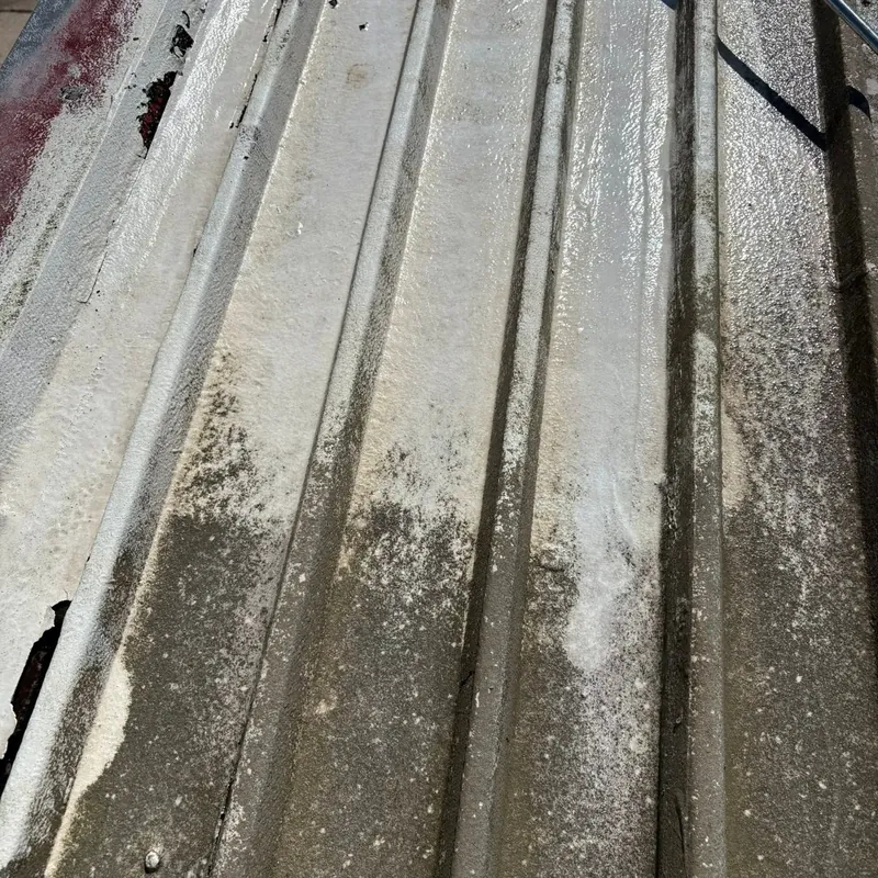 Close-up of dirty corrugated metal roof panels, C&A Roofing & Construction
