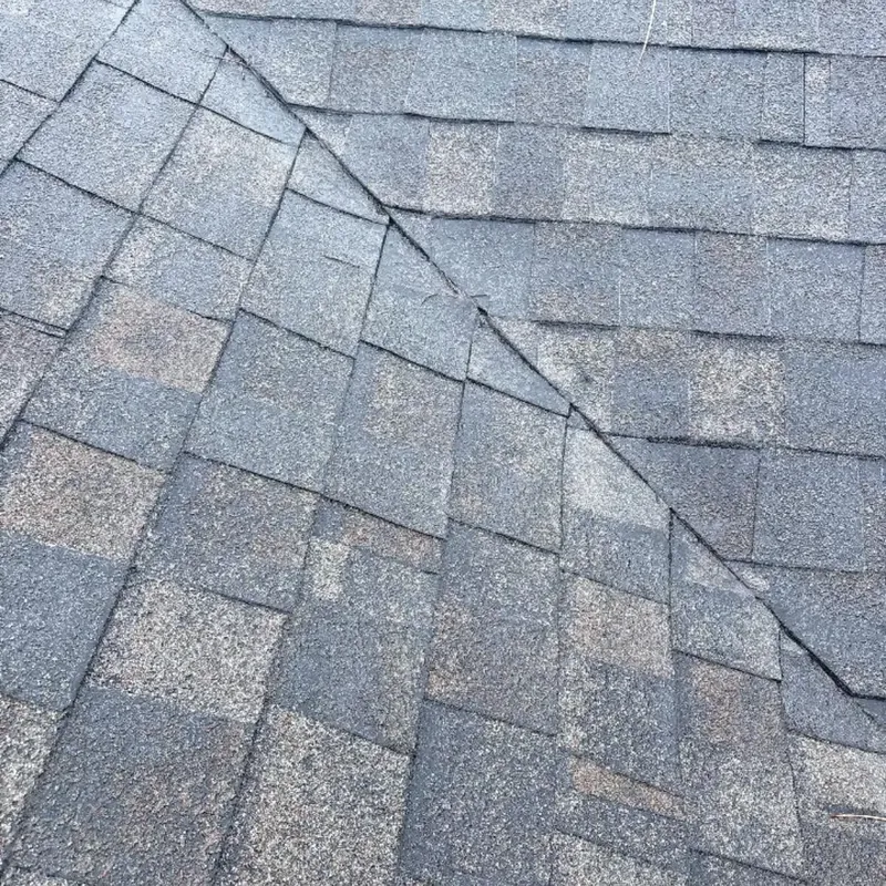 Close-up of gray shingles meeting at valley, C&A Roofing & Construction