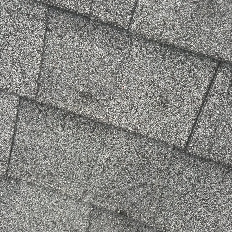Close-up of worn gray asphalt shingles, C&A Roofing & Construction