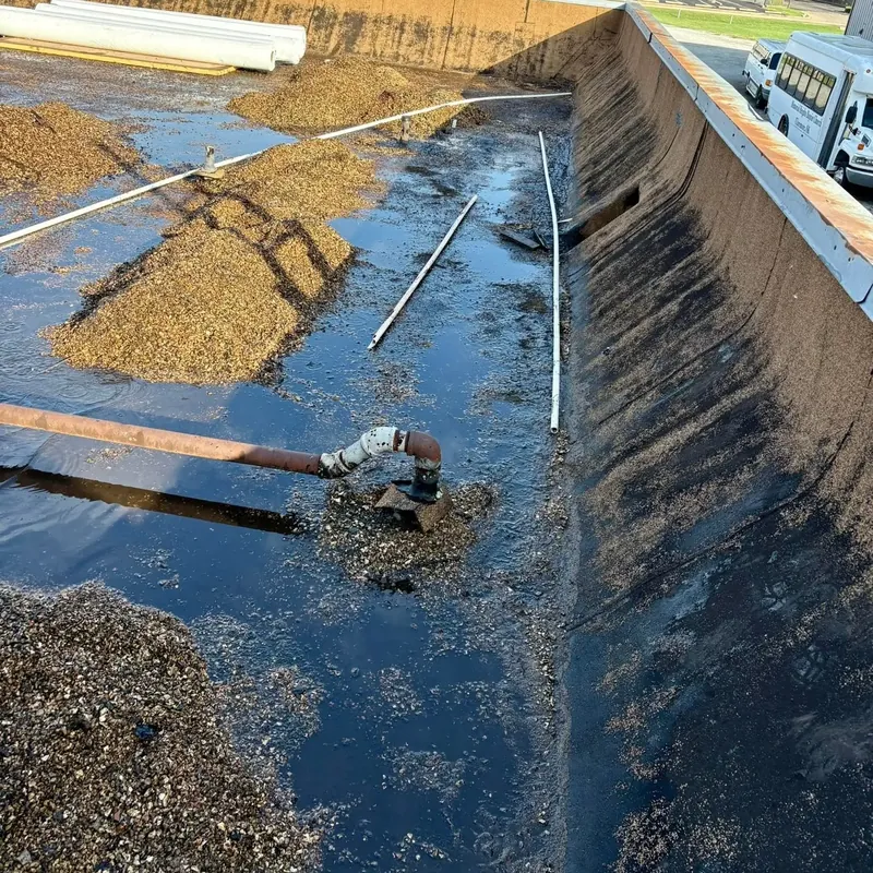 Gravel commercial flat roof with standing water, C&A Roofing & Construction