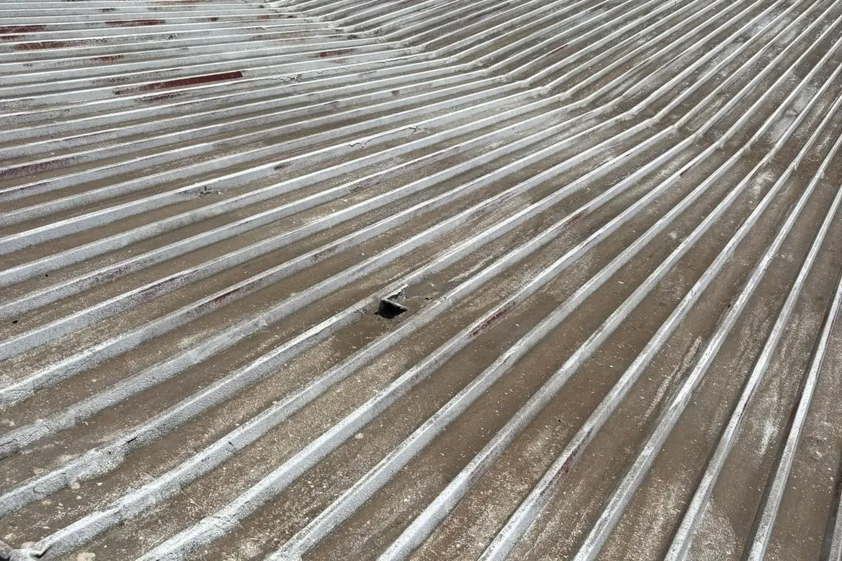 Old worn galvanized metal roof panels closeup, C&A Roofing & Construction