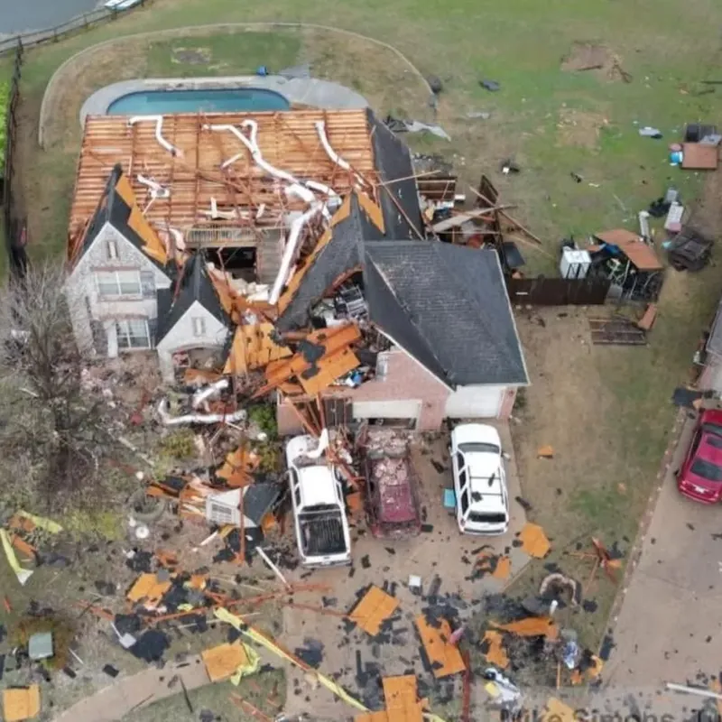 Aerial view of tornado-destroyed house with debris field, C&A Roofing & Construction
