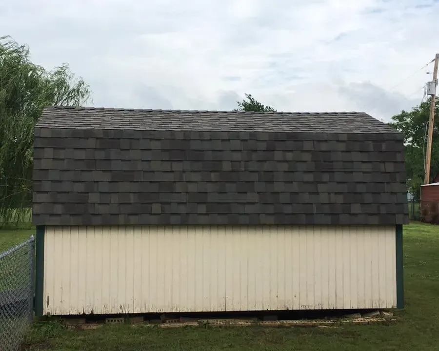 Storage shed with new dark shingle roof, C&A Roofing & Construction