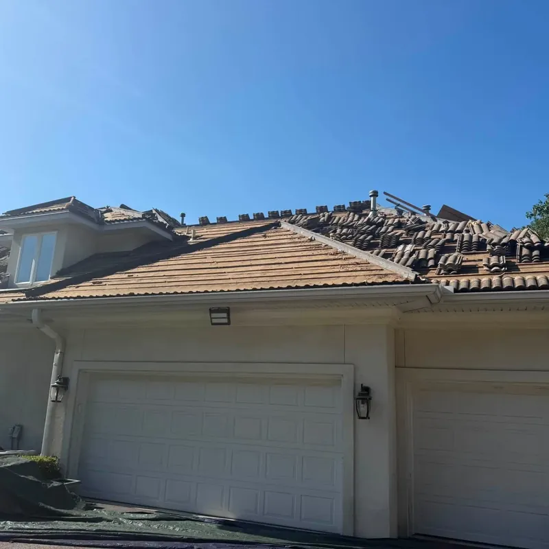 Tile roof removal on stucco house above garage, C&A Roofing & Construction