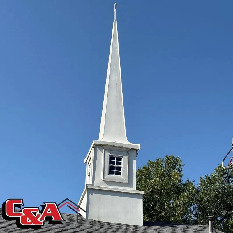 White church steeple rising from shingle roof, C&A Roofing & Construction