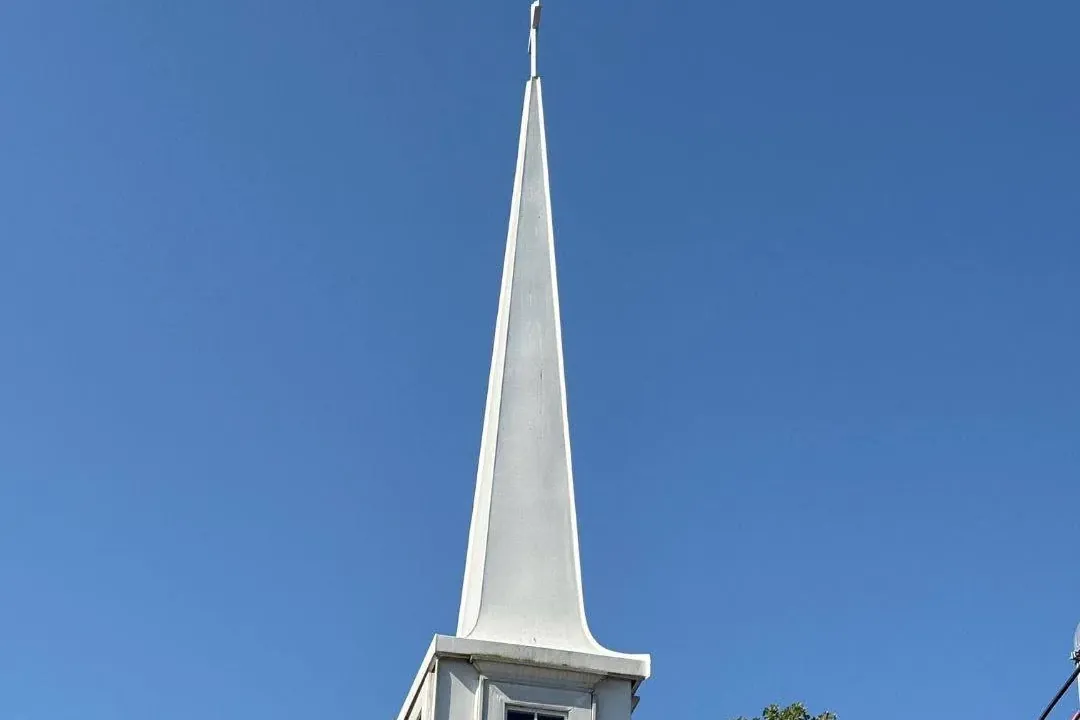 White church steeple rising from shingle roof, C&A Roofing & Construction