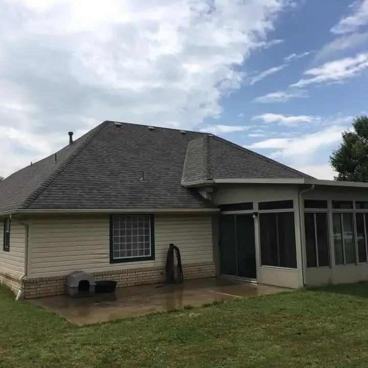 Ranch house with shingle roof and screened sunroom, C&A Roofing & Construction
