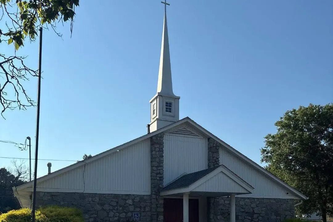 White church with steeple, stone and siding exterior, C&A Roofing & Construction